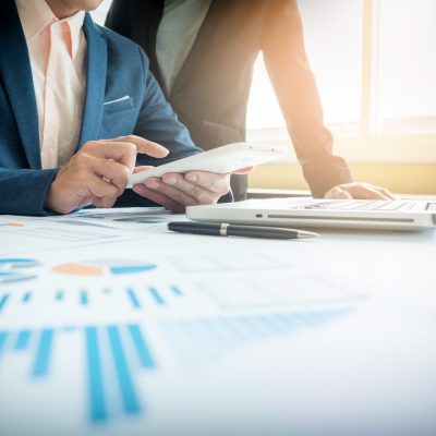 Business adviser analyzing financial figures denoting the progress in the work of the company.